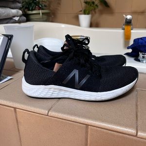 New Balance black gym shoes.